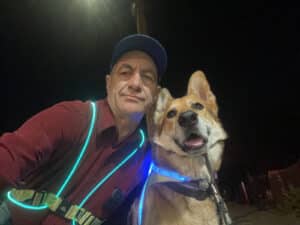 Alameda Post - Mouf and his human companion wearing light up gear at night