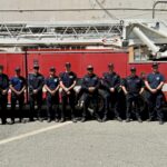 Alameda Post - ten alameda firefighters stand in front of a fire truck