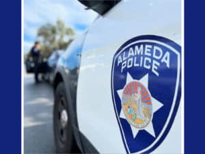 Alameda Post - a photo of a badge on an Alameda Police vehicle