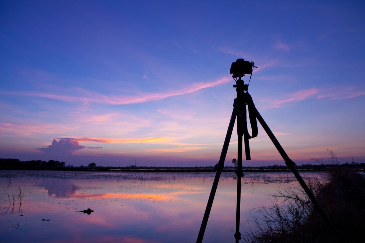 Alameda Post - a photo of a camera on a tripod overlooking the water at sunset