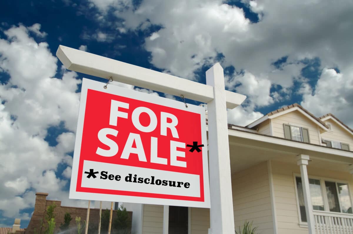 Alameda Post - a sign in front of a home that says "For Sale" with a note that says "See disclosure"
