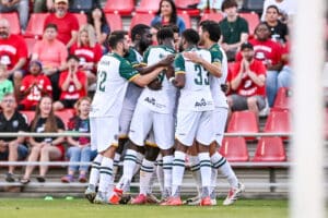 Alameda Post - the Oakland Roots team gathers together in a huddle in the match versus San Antonio FC