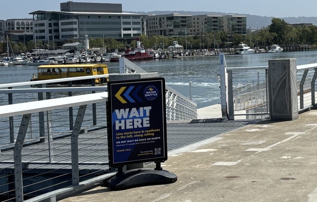 Alameda Post - a sign in front of Woodstock's ramp that says "Wait Here."
