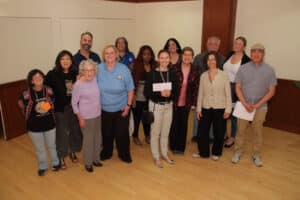Alameda Post - a group of nonprofit representatives stand with checks and smile at the camera after receiving grants from the Alameda Kiwanis Foundation
