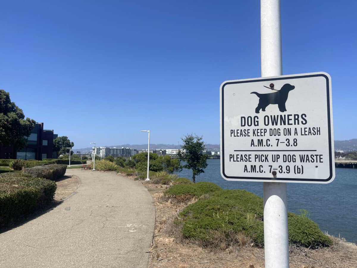 Alameda Post - a sign on a waterfront trail that reminds dog owners to leash their dogs 