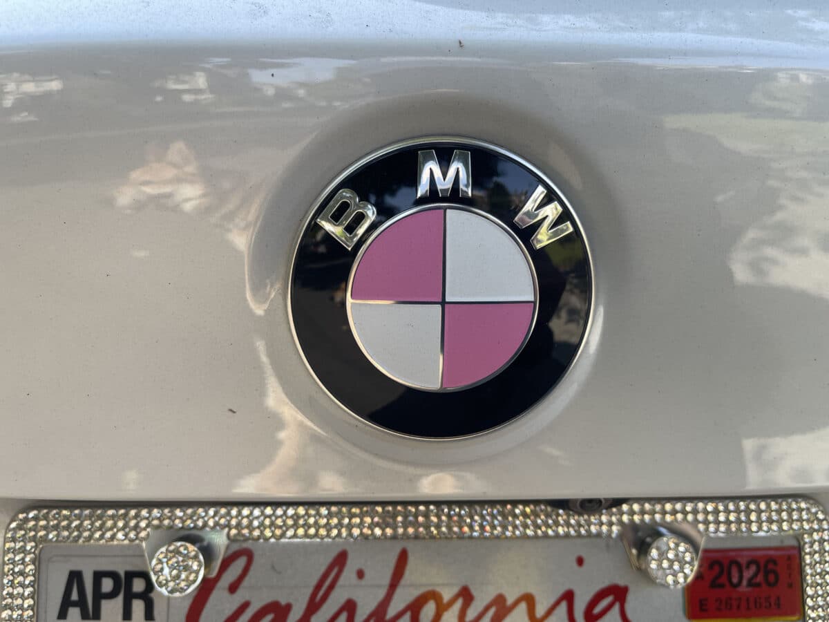 Alameda Post - a BMW logo on a car with pink details