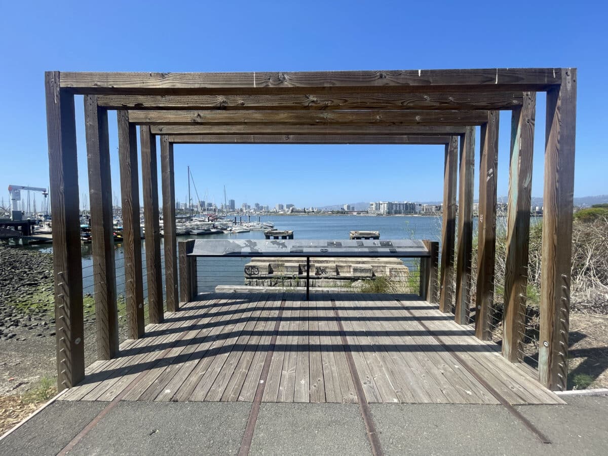 Alameda Post - a partially covered platform that overlooks the estuary with signs about the shipping industry