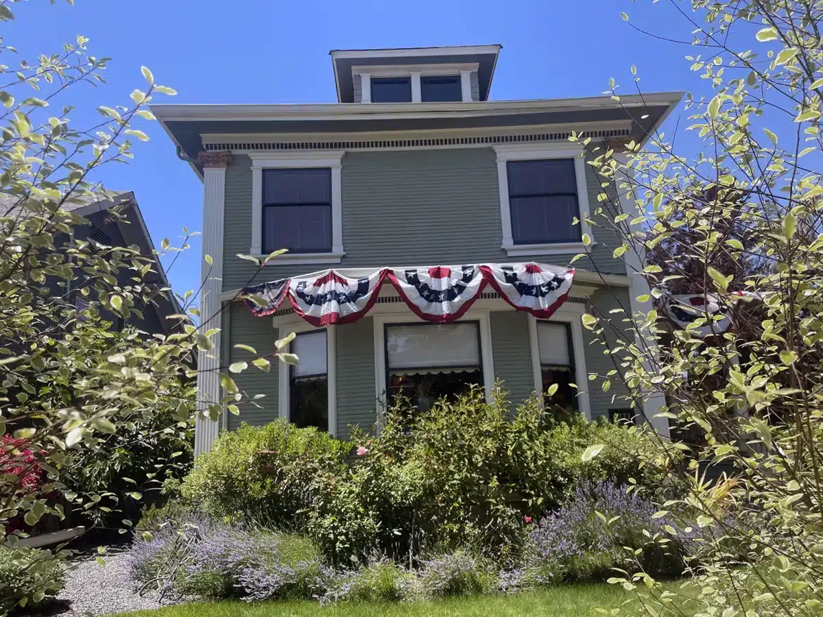 Alameda Post - Bear's-Eye View of Alameda for June 29, 2025. A house with festive red white and blue bunting