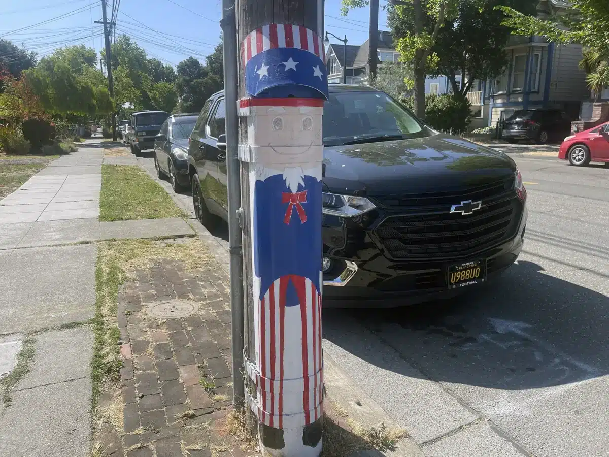 Alameda Post - Bear's-Eye View of Alameda for June 29, 2025. A caricature of Uncle Sam painted on a utility pole