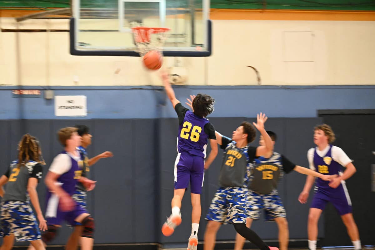 Alameda Post - a middle school basketball player shoots towards the basket