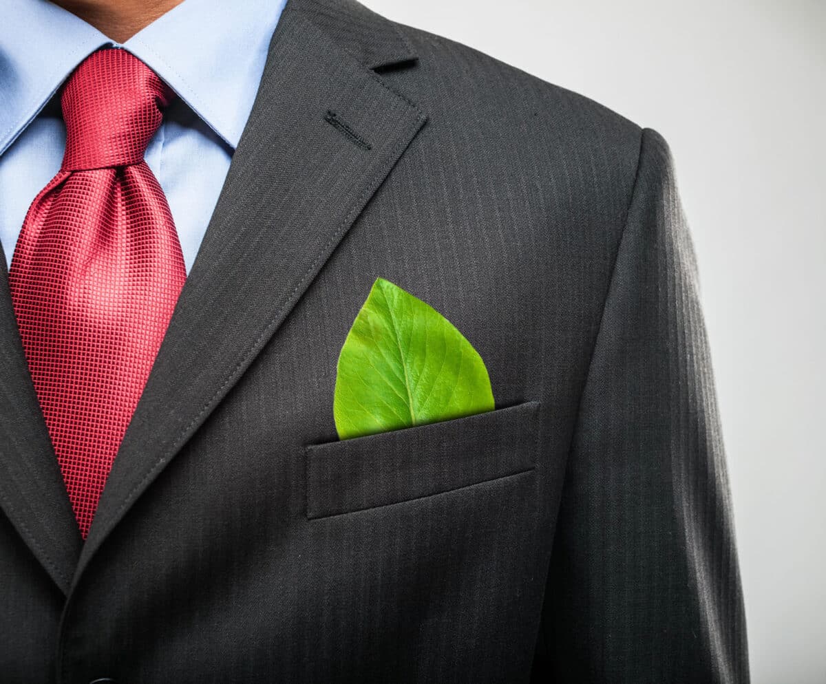 Alameda Post - a photo of a person in a suit with a leaf sticking out of their pocket