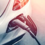 Alameda Post - an ev plugs into a charging station