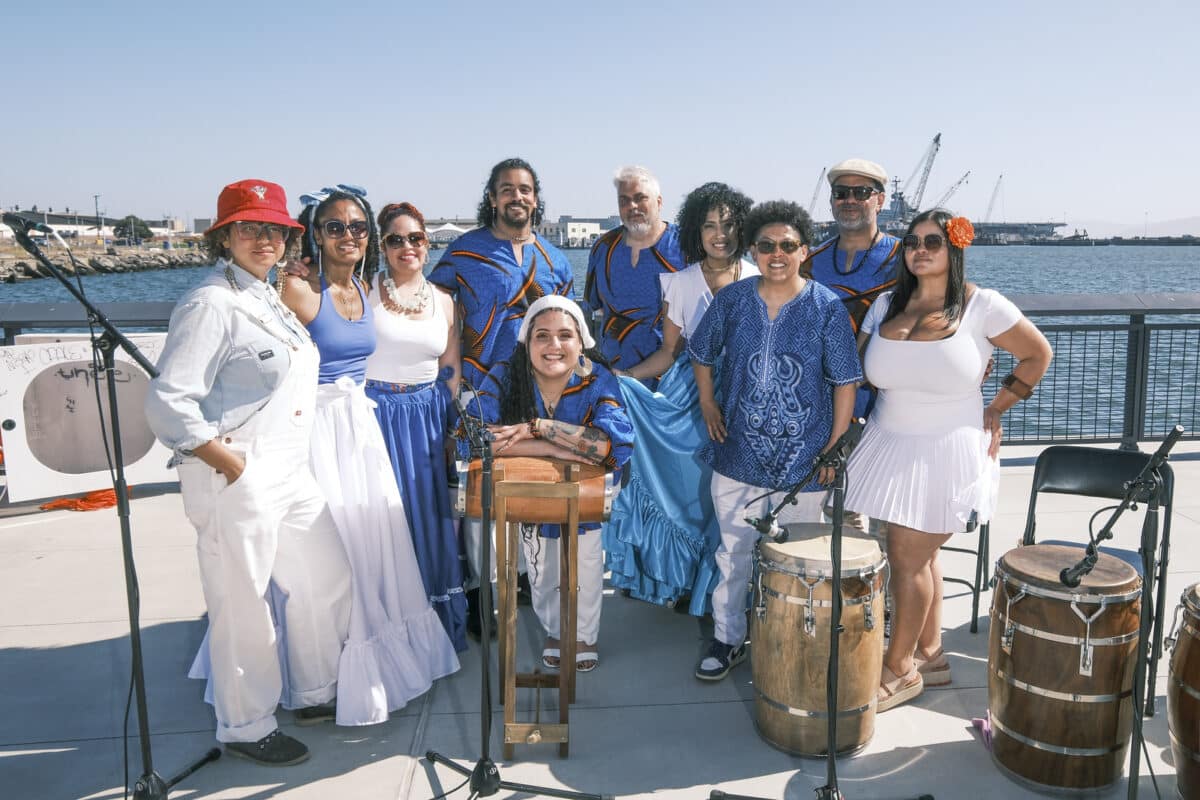 Alameda Post - performers smile for a group photo