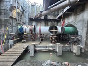 Alameda Post - a large below ground construction site with EBMUD pipes
