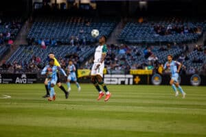 Alameda Post - an Oakland Roots player heads the ball in a match against El Paso Locomotive