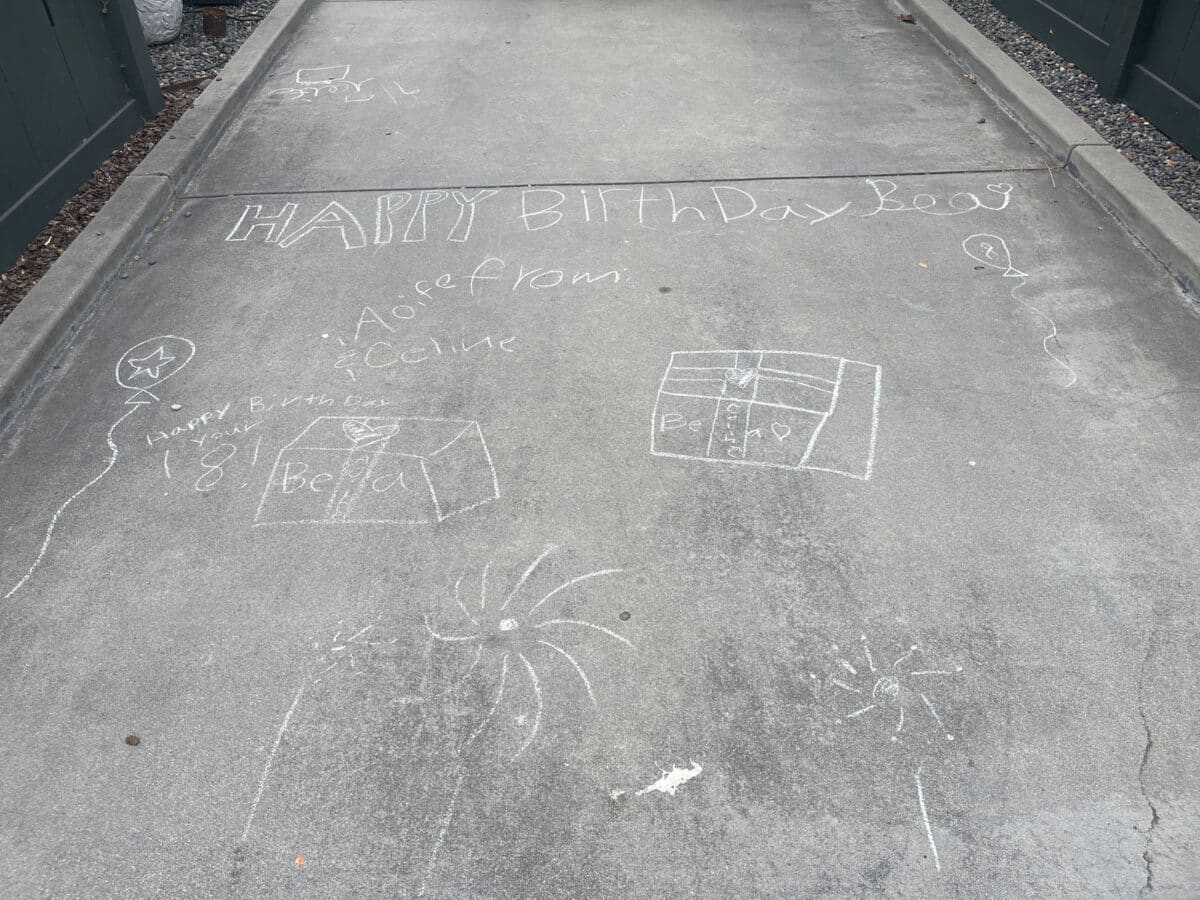 Alameda Post - chalk artwork in a driveway that says "Happy Birthday Bea" 