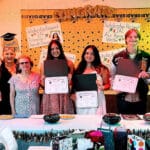 Alameda Post - scholarship winners of the Italian American League of Alameda smile and hold certificates surrounded by adults