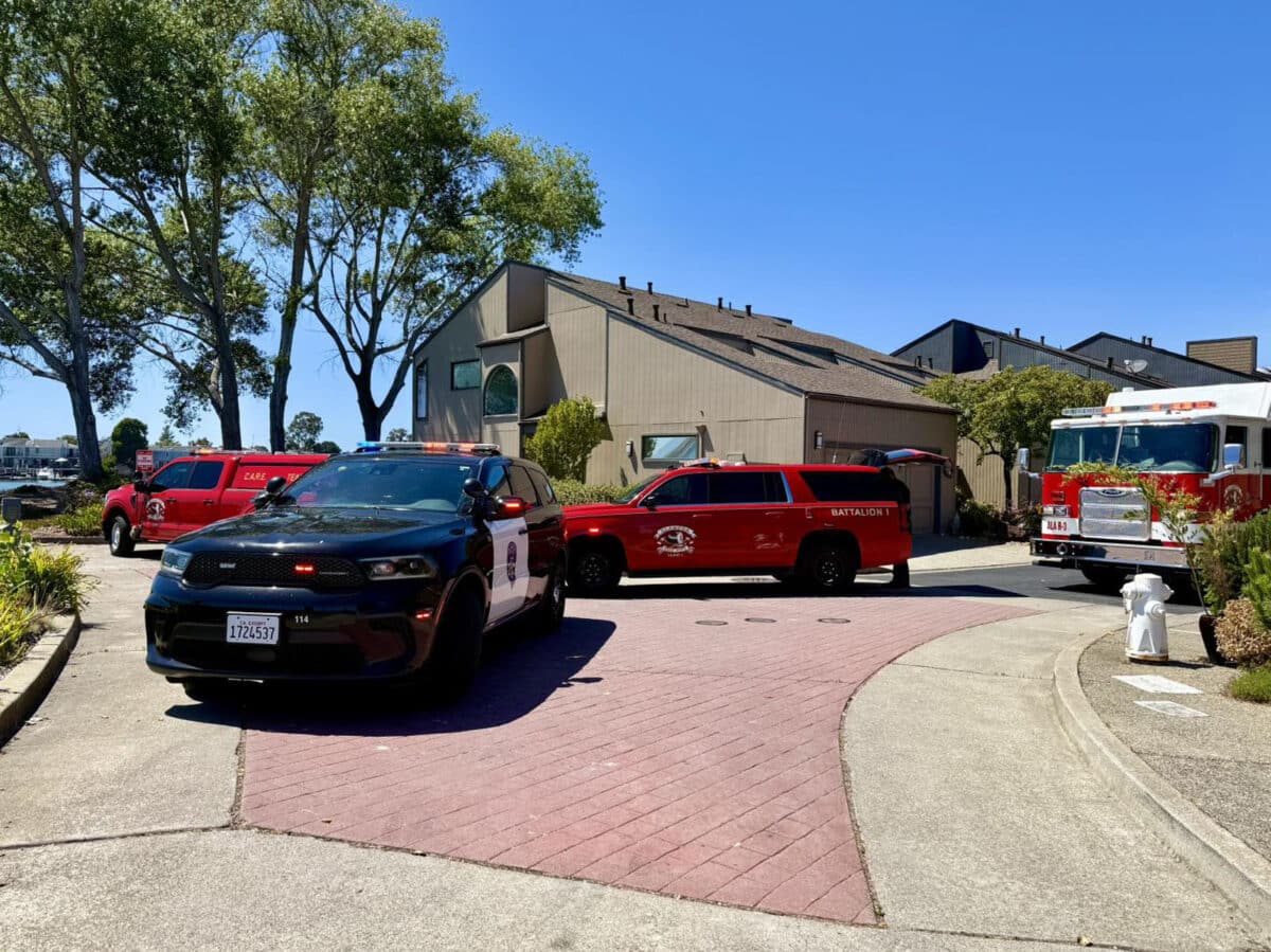 Alameda Post - Alameda Fire Department and Police Department vehicles parked in front of homes by Ballena Bay