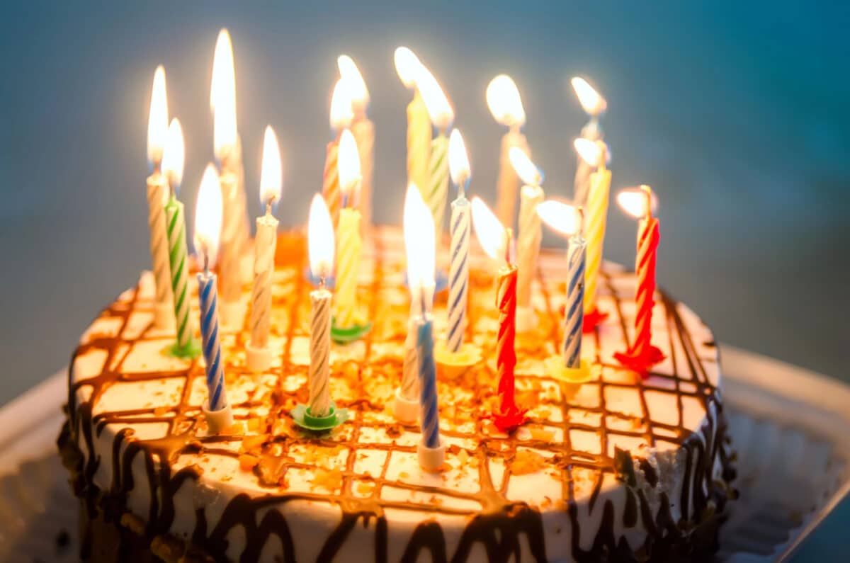 Alameda Post - a birthday cake with lit candles
