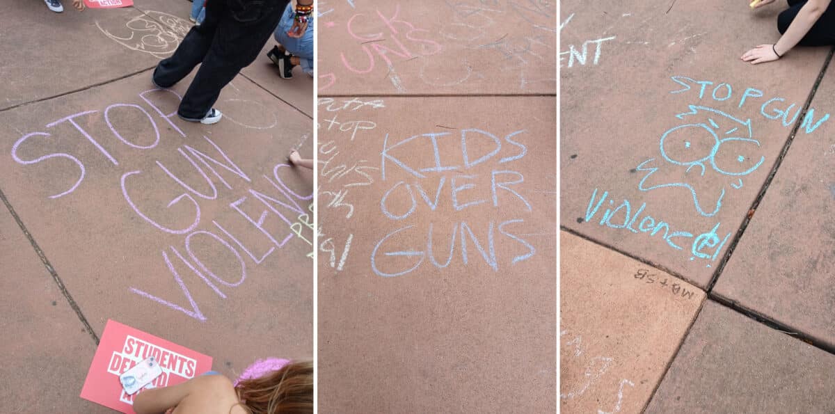 Alameda Post - sidewalk chalk on the ground in front of City Hall that says "Stop gun violence" and "Kids over guns"