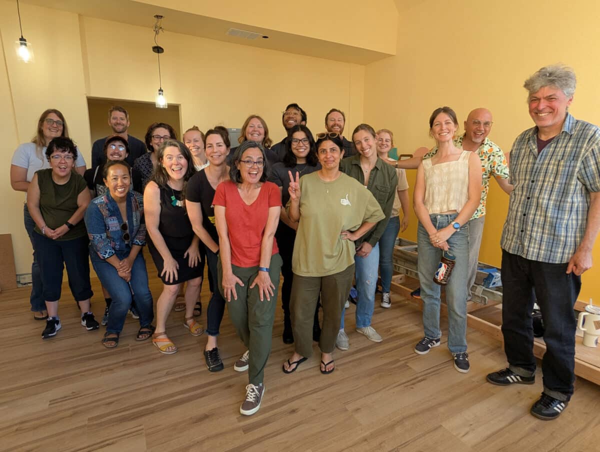 Alameda Post - inside Improv Central a group of adults smile at the camera