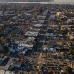 Alameda Post - an aerial view of Alameda with Bay Farm Island. in the background.