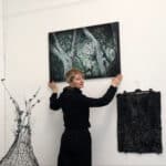 Alameda Post - Anita Sulimanovic hangs artwork.
