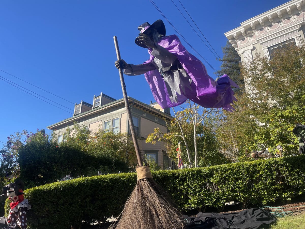 Alameda Post - A large Halloween decoration of a witch hovering above a broomstick.