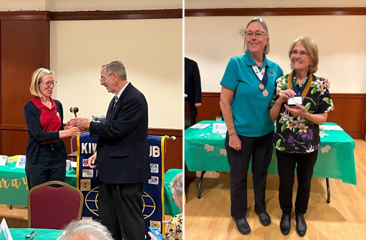 Alameda Post - Two people accept awards or recognition of some kind at the front of the room during a Kiwanis meeting. 