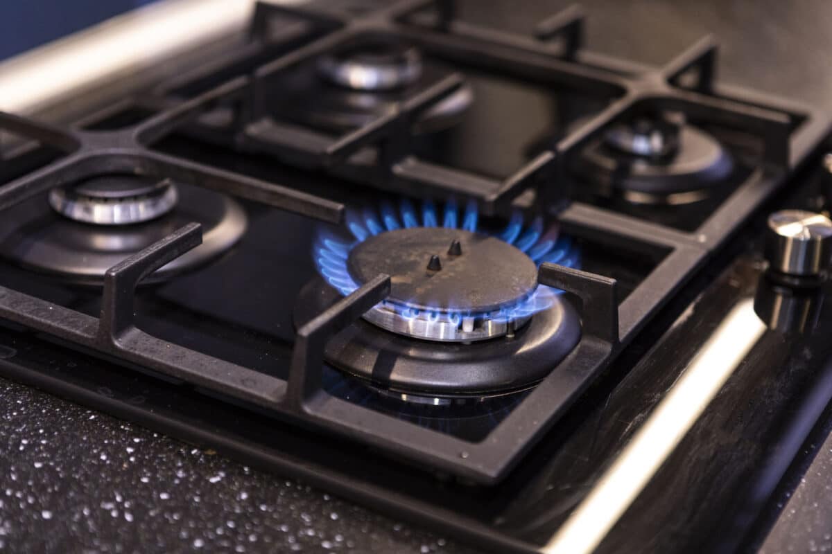 Alameda Post - A gas stove burner that is lit.