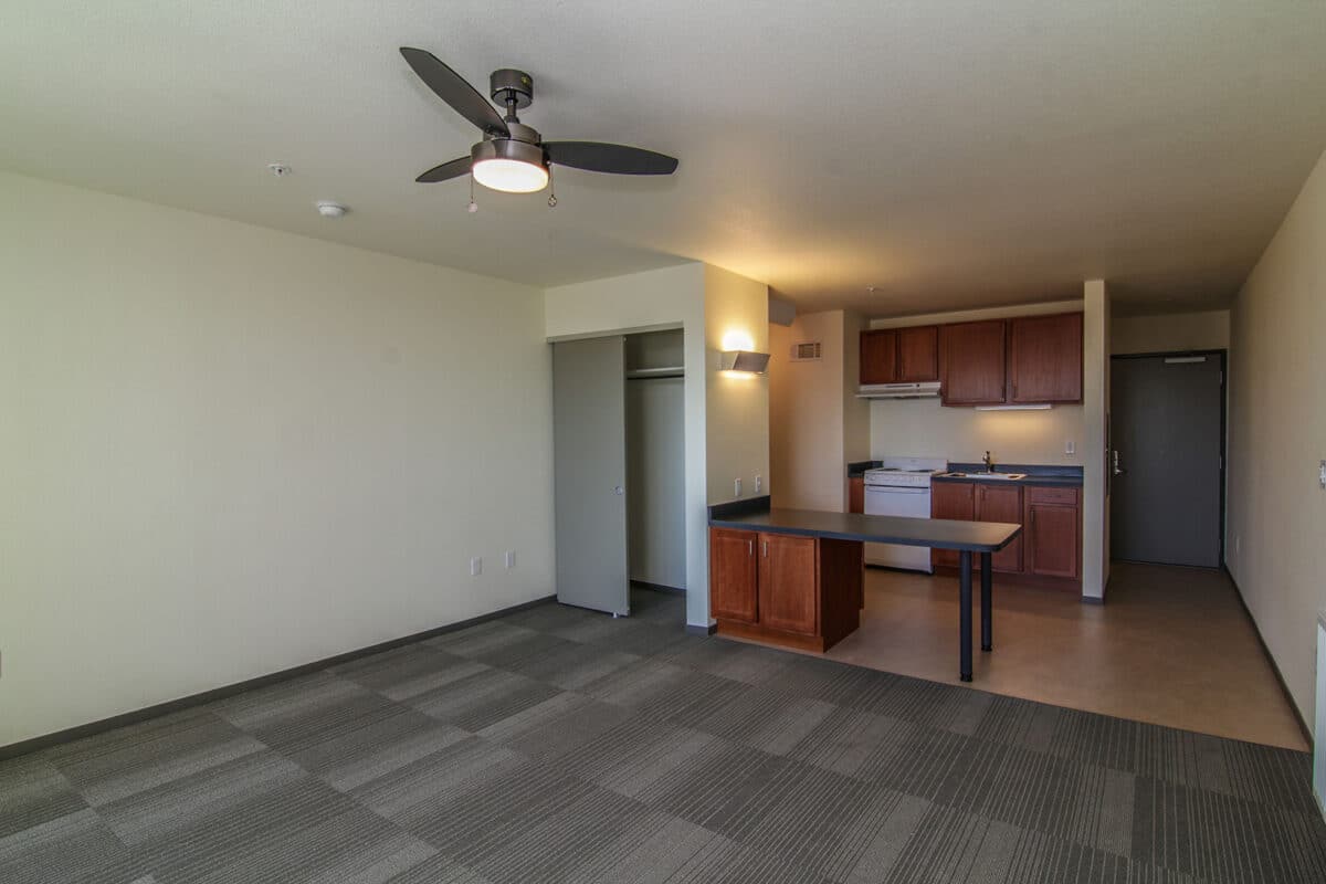 Alameda Post - A small studio apartment with a kitchenette. 