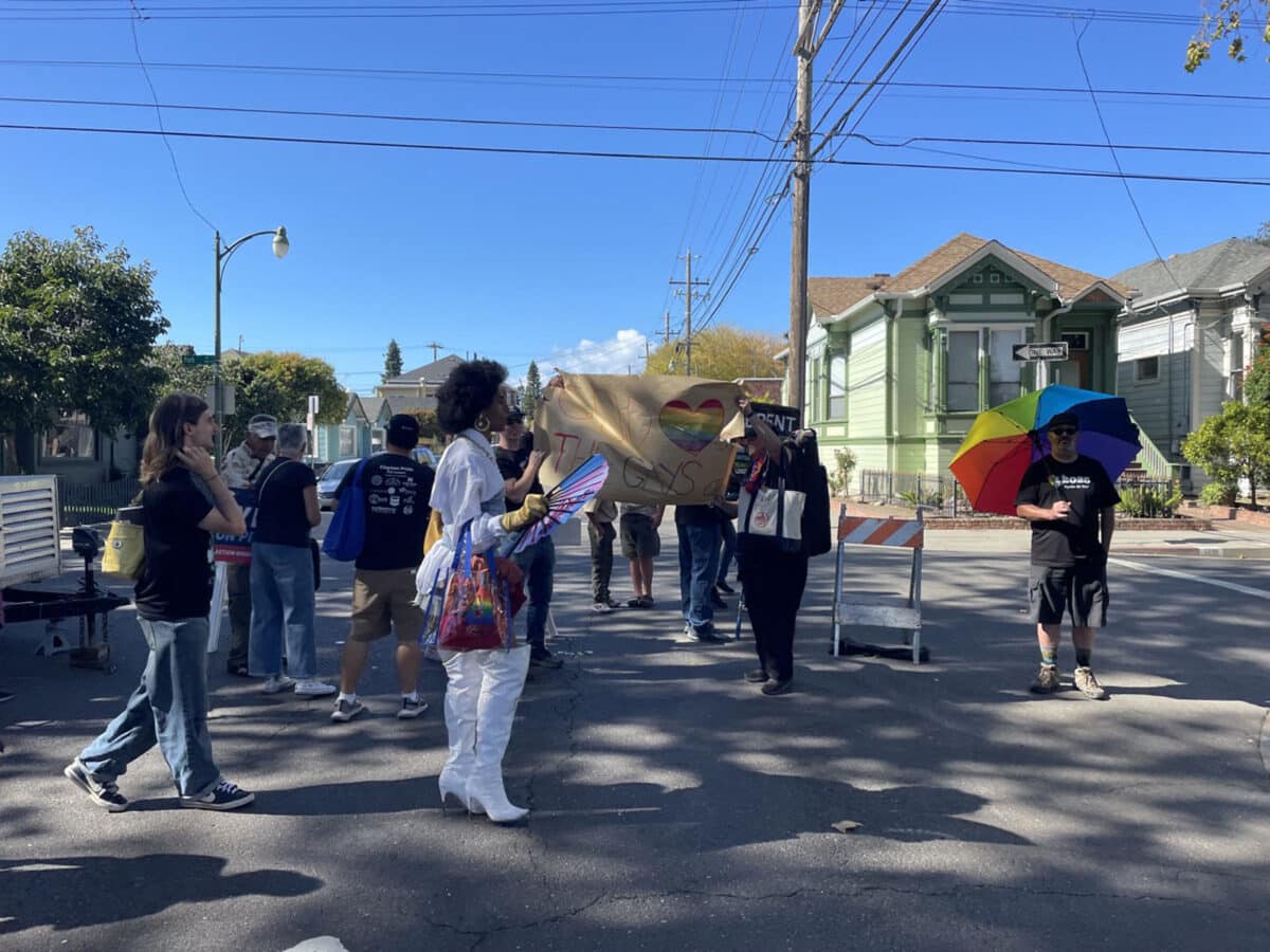 Alameda Post - A small crowd of Pride attendees peacefully block a protestor. 