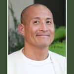 Alameda Post - Michael Kramer Wong smiles in a headshot photo.