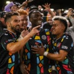 Alameda Post - Oakland Roots players smile together as the crowd cheers after their season finale against Lexington SC.