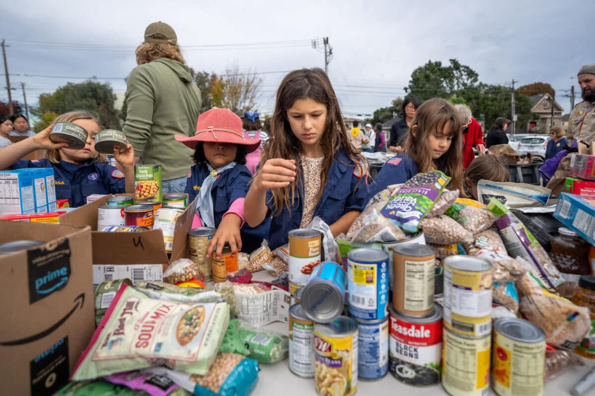 Alameda Post - Young scouts sort food at the Scouting for Food event.