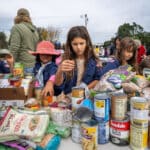Alameda Post - Young scouts sort food at the Scouting for Food event.