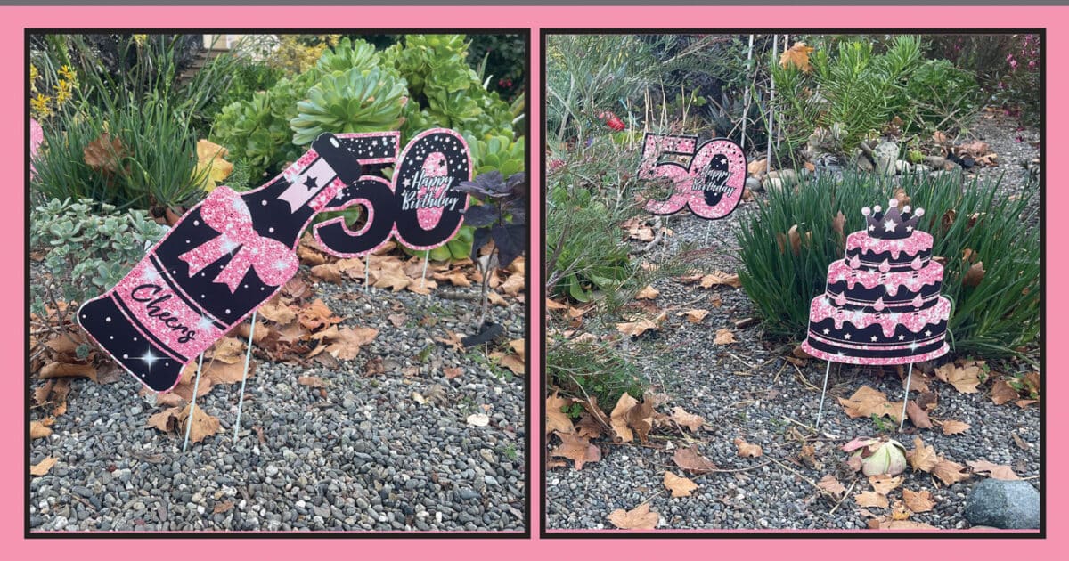 Alameda Post - Large decor in sparkly pink and black. They say "Cheers," and "Happy Birthday" with images of a cake and a champagne bottle. 