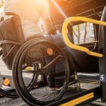 Alameda Post - A photo of a wheelchair user boarding an accessible van.