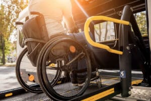Alameda Post - A photo of a wheelchair user boarding an accessible van.