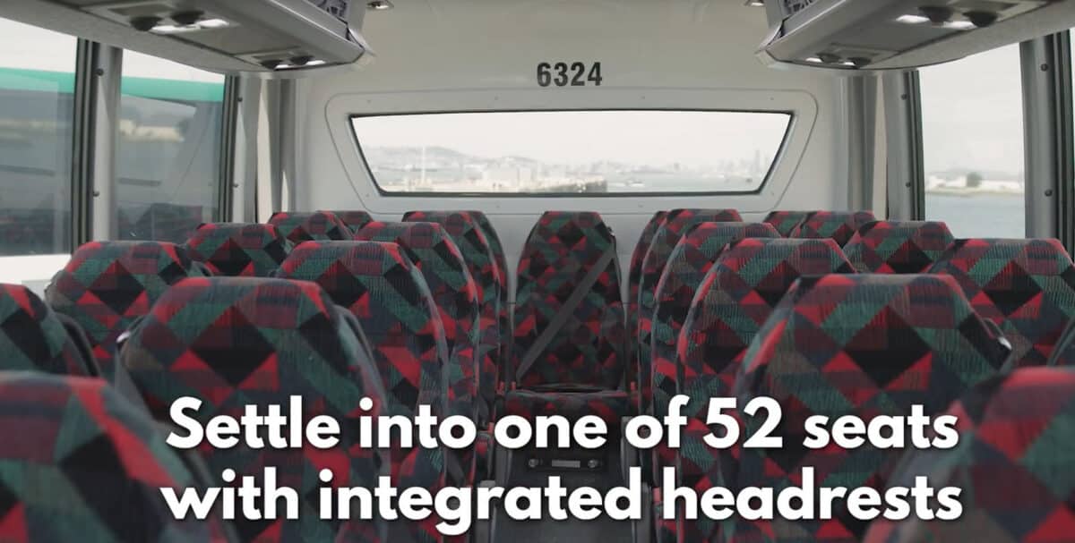 Alameda Post - A photo of an AC Transit bus with text on top that says "Settle into one of 52 seats with integrated headrests."