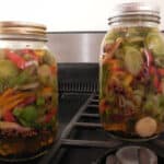 Alameda Post - Jars of colorful vegetables in a pickling liquid.