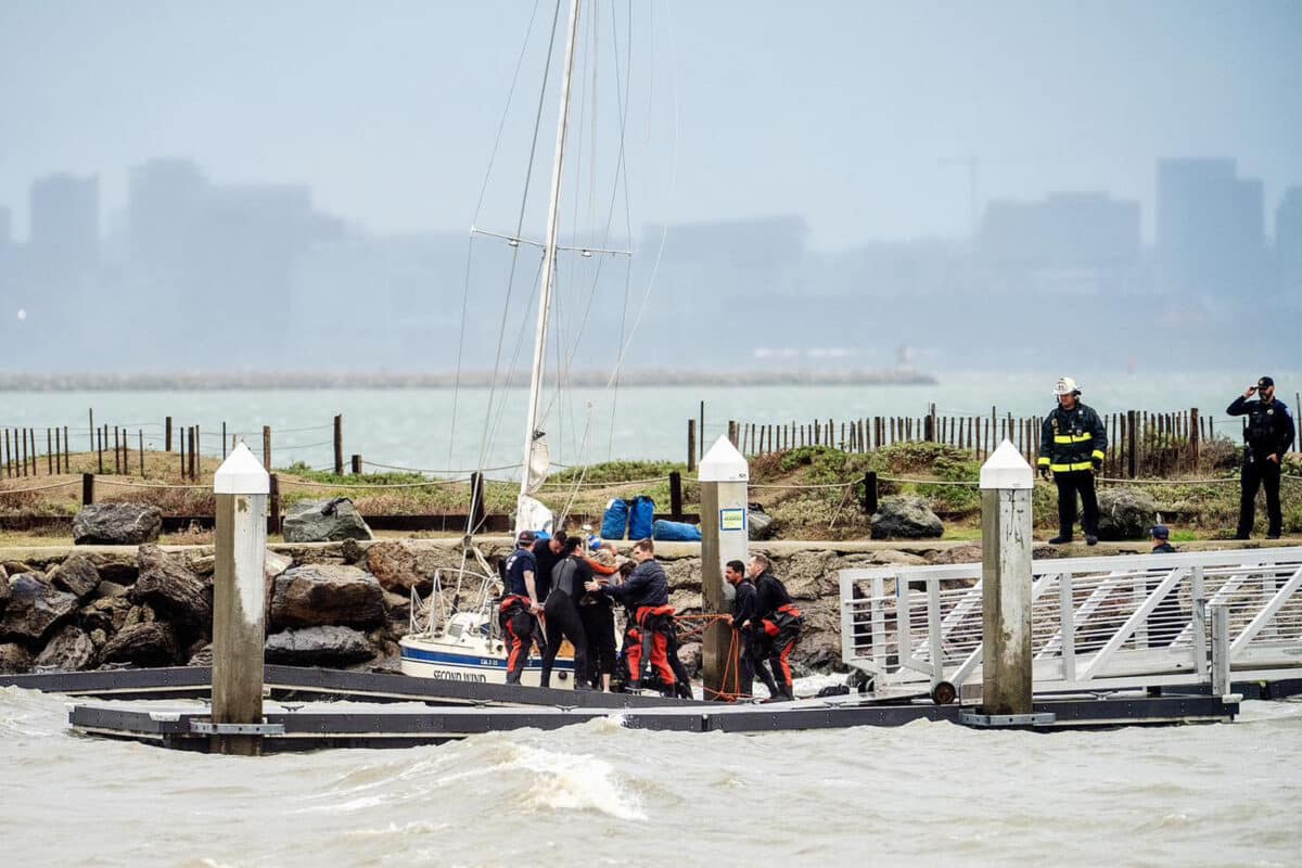 Alameda Post - Emergency personnel gather need a vessel taking on water in the Oakland Alameda Estuary.