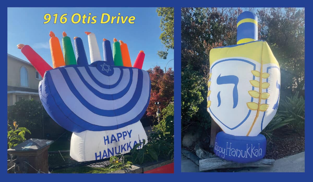 Alameda Post - Large blow up Chanukah decorations. One is a dreidel and the other is a menorah.