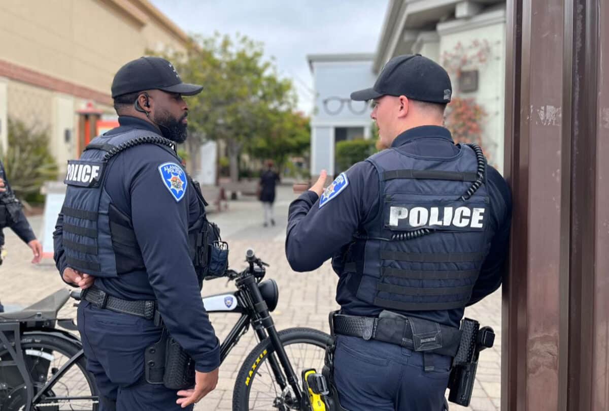 Alameda Post - Two APD patrols talk with one another at South Shore Shopping Center. 