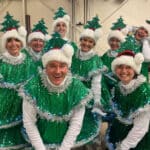 Alameda Post - About eight new saplings smile in their Christmas tree costumes.