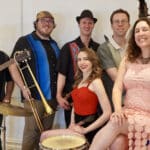 Alameda Post - A group photo of the six members of the Death and Taxes Swing Band.