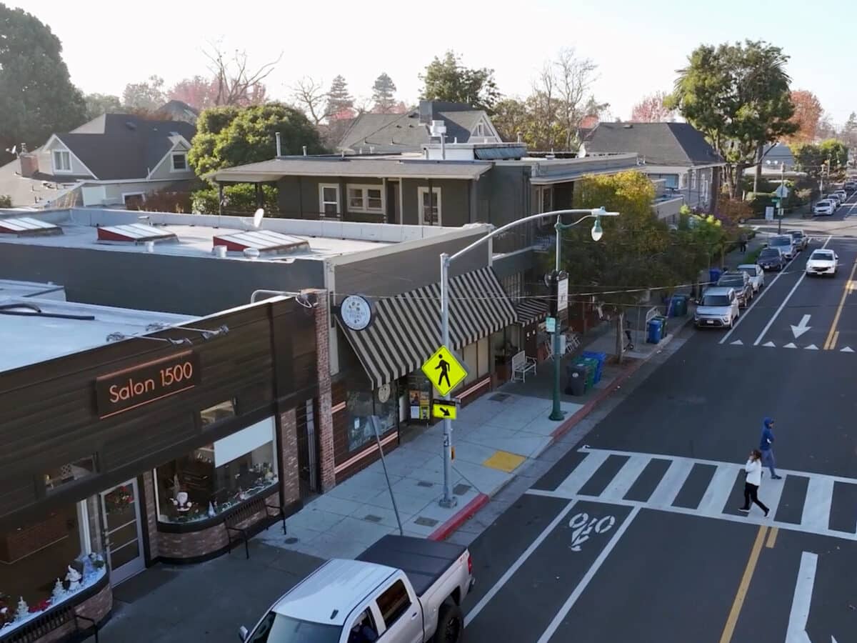 Alameda Post - A photo of a quaint Alameda shopping area with a salon and grocery store. 