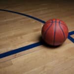 Alameda Post - A basketball on a basketball court.