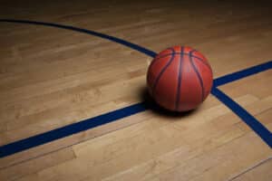 Alameda Post - A basketball on a basketball court.
