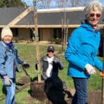 Alameda Post - Volunteers smile while planting trees at Leydecker Park.
